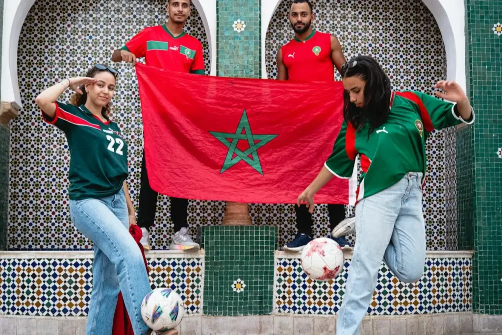 Fans in Morocco football jerseys proudly displaying the national flag in preparation for CAF 2025