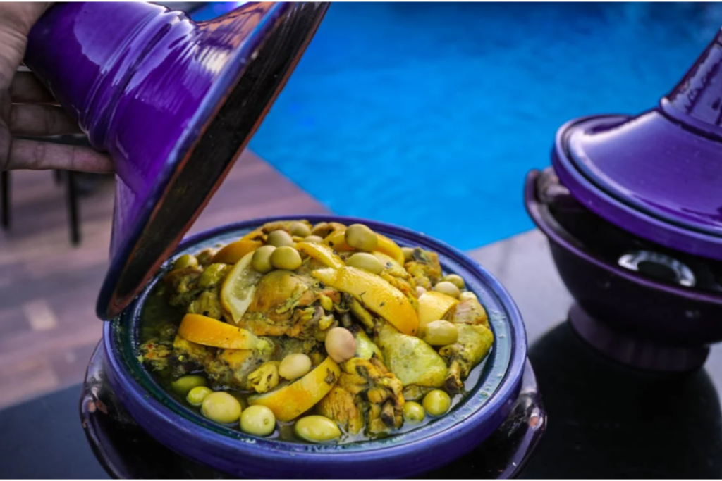 Traditional Moroccan chicken tagine with preserved lemons, olives, and aromatic spices served in an earthenware pot